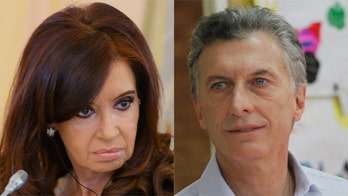 Fierce enemies, Argentina's incoming and sitting presidents trade barbs, clash over sash