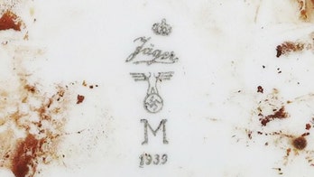 Human skeletons, artifacts recovered from WWII Nazi U-boat discovered off Indonesia