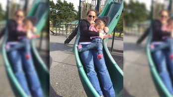 Photo captures moment toddler's leg broke while on slide with mom
