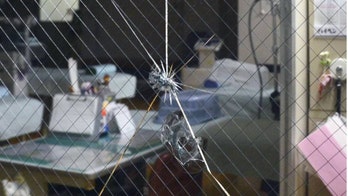 Malfunctioning airplane engine drops metal into neighborhood, hits clinic