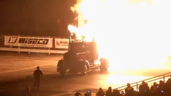 Jet truck dragster burns rubber, lights sign on fire