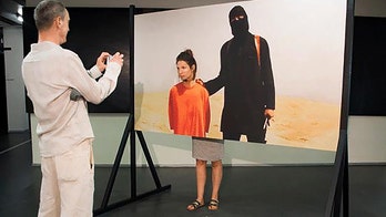 Outrage over artwork allowing visitors to pose as victims of ISIS killer Jihadi John
