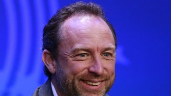 Wikipedia co-founder Jimmy Wales launches charitable social network, phone service