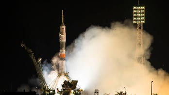 Russian space capsule docks at International Space Station