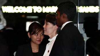 Kim Jong Un's sister arrives in Singapore in separate plane from North Korean leader