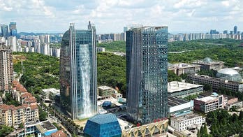 Watch: Chinese skyscraper boasts 350-foot waterfall streaming down its side