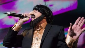 Rapper Macklemore apologizes for wearing an 'anti-Semitic' outfit in concert