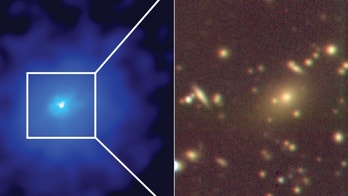 Monster black hole 'feeding frenzy' hides hundreds of galaxies in new photo