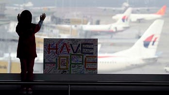 Australia shifts MH370 search area south, says jet was on autopilot when it crashed