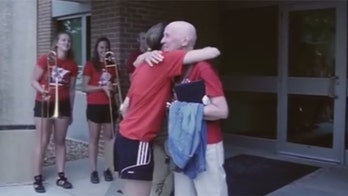 Marching band accompanies cancer patient out of last treatment