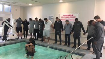 Philadelphia Eagles' Marcus Johnson baptized in hotel pool with teammates by his side