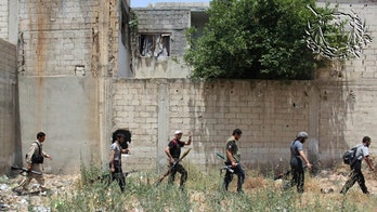 Syrian rebels evacuate crucial city of Homs as part of ceasefire deal