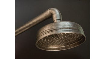 Hip shower heads for loft bathrooms