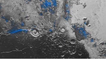 NASA spacecraft discovers blue sky, red ice on Pluto