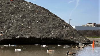 Snow piles linger in Boston, including one that's 3 stories high and filled with trash