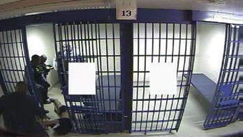 New Chicago police video shows inmate being dragged from cell