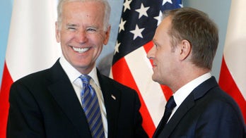 Biden arrives in Poland to reassure allies as Russia seeks to annex Crimea