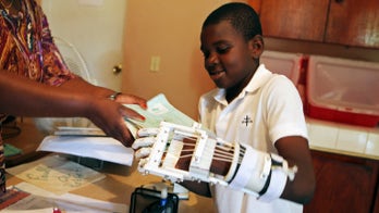 Haitian orphan gets nation's first 3-D printer prosthesis