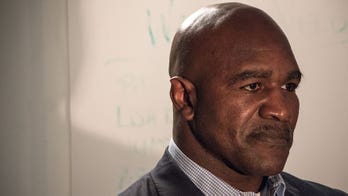 Stone-faced Holyfield has starring role in road rage PSA