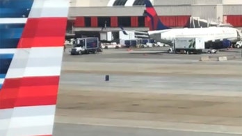 Suitcase recorded making a break for it at Atlanta International Airport