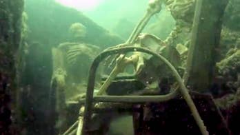 Authorities say couple thought fake skeletons on chairs would make amusing diving landmark