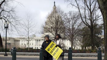 Justice Department sues North Carolina over voter law