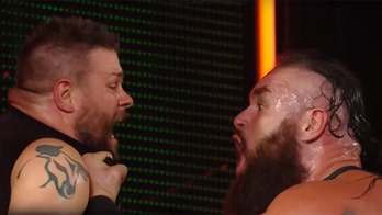 WWE's Kevin Owens gets thrown off a massive ladder by Braun Strowman