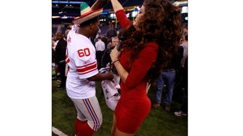 Too Sexy for the Super Bowl? Reporter's Attire Sparks Debate, Again