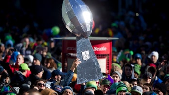 Super Bowl: Deflated balls, inflated TVs