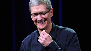 Apple CEO Tim Cook's pay slumps along with iPhone sales