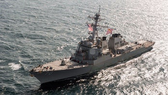 US destroyer sails near contested reef in South China Sea angering Beijing