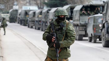 Kerry says West will respond to Putin's 'aggression,' will travel to Kiev for talks