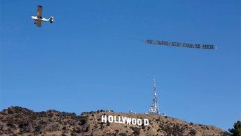 Pilot flies banner over Hollywood sign: 'Stop Enabling Abuse'