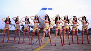 Airline sparks outrage after scantily-clad models put on show