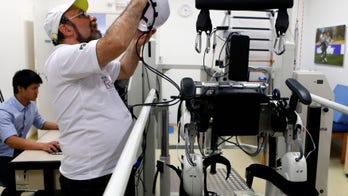 Standing paraplegic patient kicks ball to open World Cup