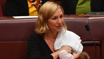 Australian senator breastfeeds baby on floor of Parliament