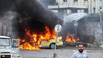 The Latest: Multiple blasts kill at least 20 in Syria