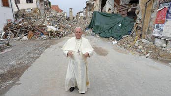 Pope Francis makes surprise visit to quake zone