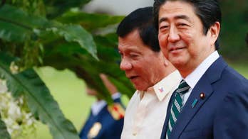 Abe ends Philippine visit with investment, speedboat pledge