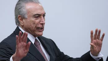 Brazil president puts investigated lawmaker in Congress post