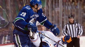 Jannik Hansen scores twice, Canucks beat Oilers 2-1 for 1st overtime win of season