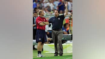 AP Interview: Arena says pressure on US team has increased