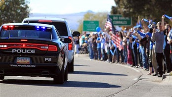 Albuquerque lays slain officer to rest in emotional service that draws thousands