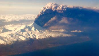 Alaska volcano spews smaller amounts of ash at lower levels