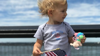 ACLU backs down in face of Twitter’s wrath for pic of white baby holding US flag