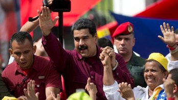 Members of Venezuela's divided opposition begin talks with the gov't