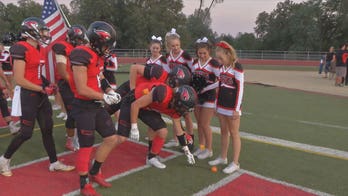 High school cheerleader with leukemia honored by football team