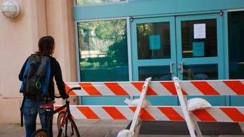 Researcher who lost arm in blast sues University of Hawaii