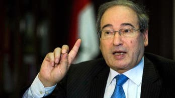 AP INTERVIEW: Top Syrian official rules out Assad departure
