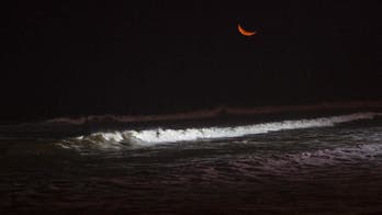 AP PHOTOS: Peru's capital rigs a beach for nighttime surfing